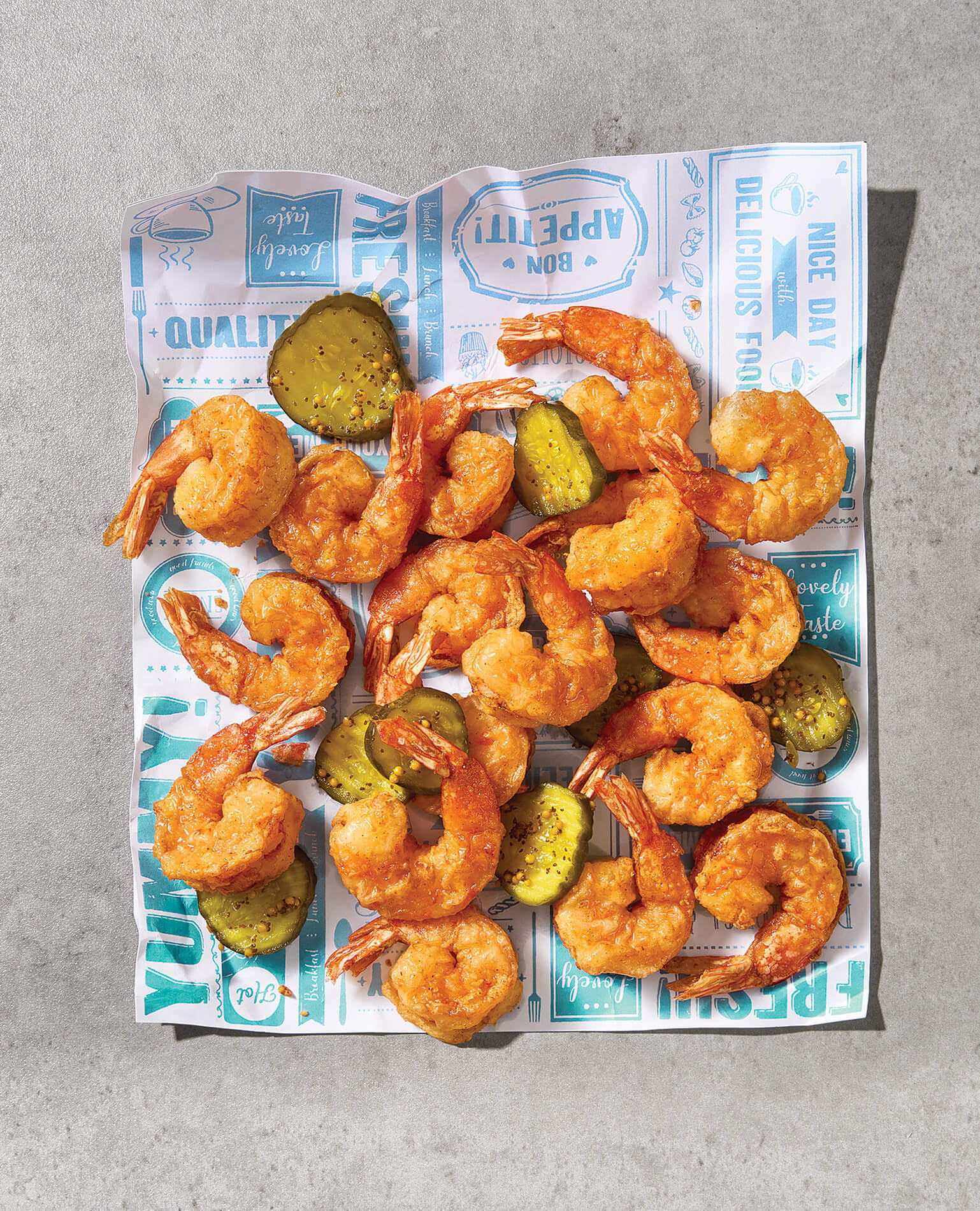A pile of spicy shrimp and pickles.