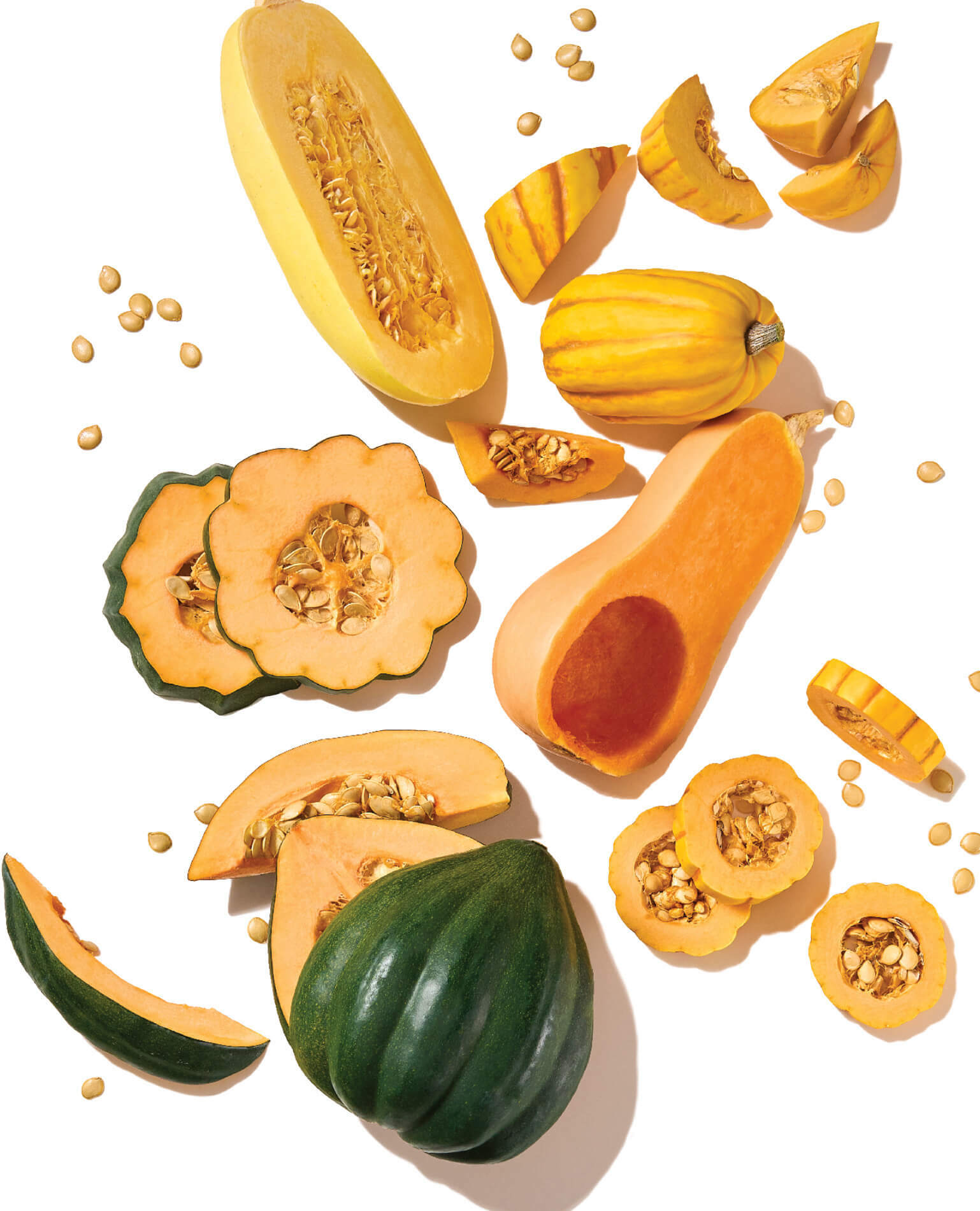 Various cut squash on a white background.