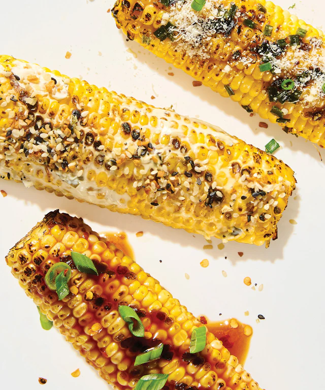 Grilled sweet corn with various seasonings