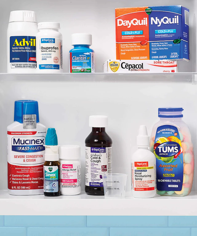 Shelves in a medicine cabinet holding various medicines