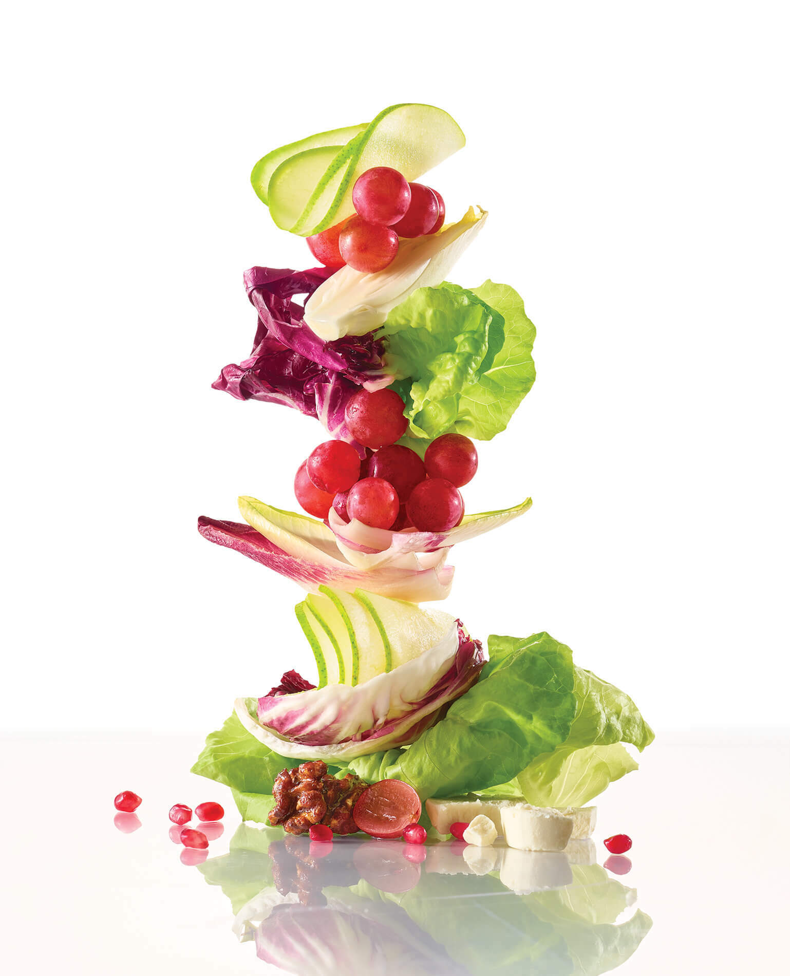 Colorful vegetable pieces stacked together in a sort of sculpture.